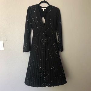 Black mid length dress with cut out back